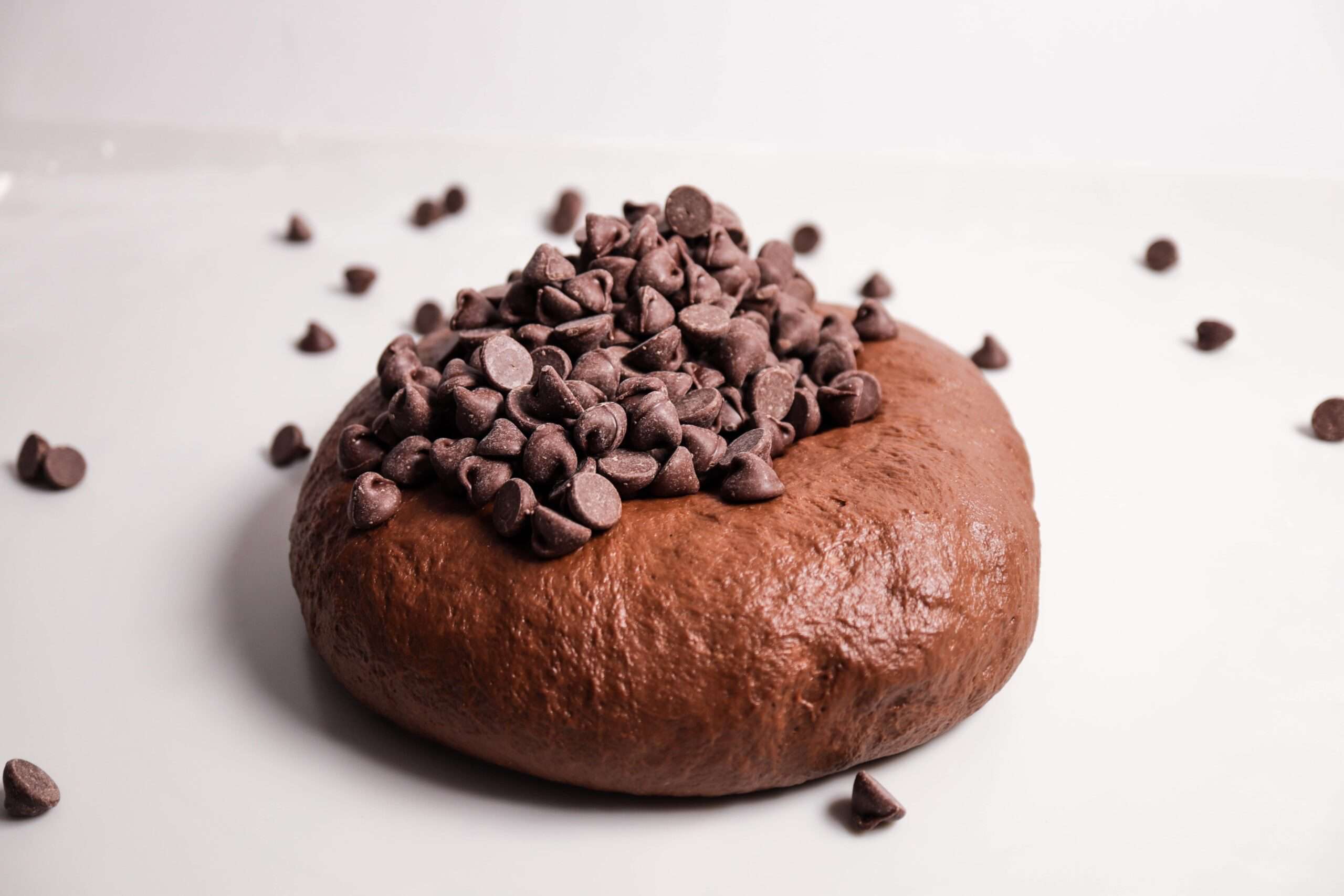 Chocolate bread dough with pile of chocolate chips on top