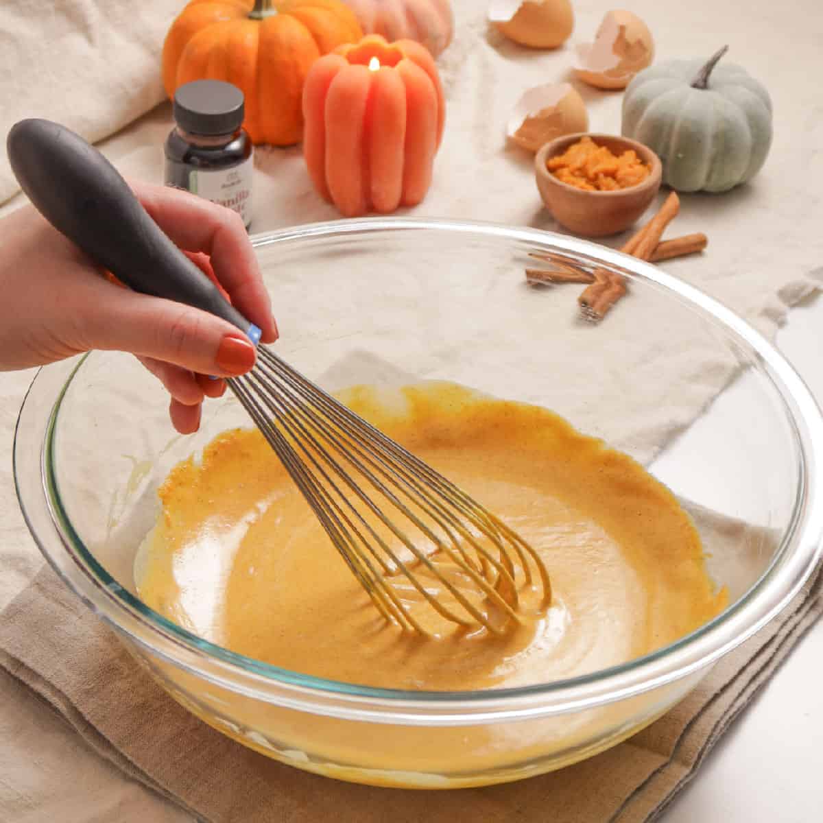 whisking pumpkin custard