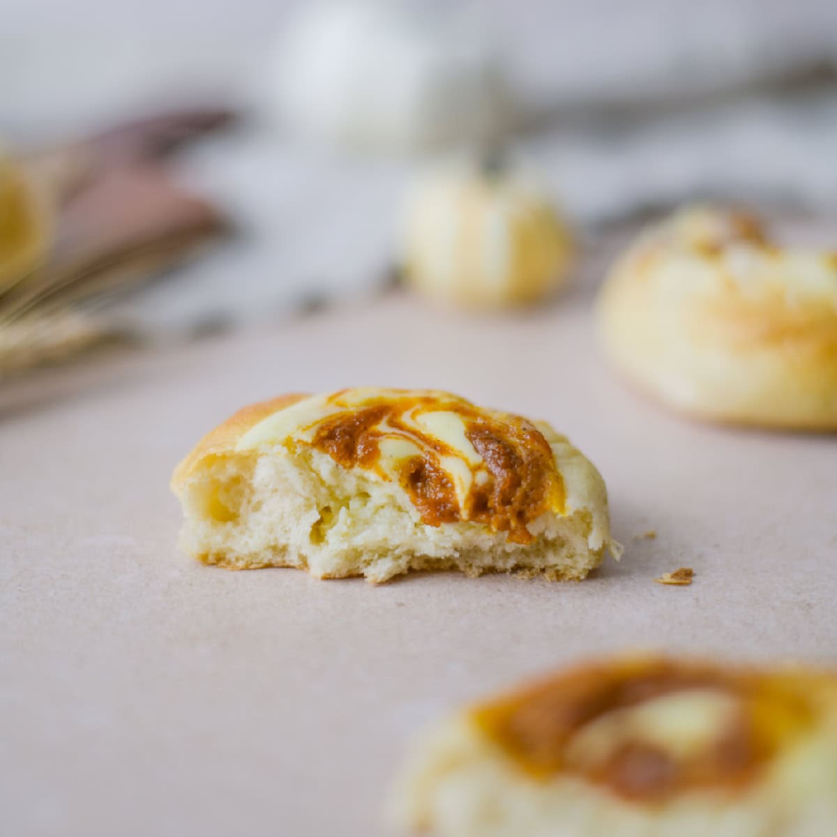 half of a pumpkin cheesecake kolache