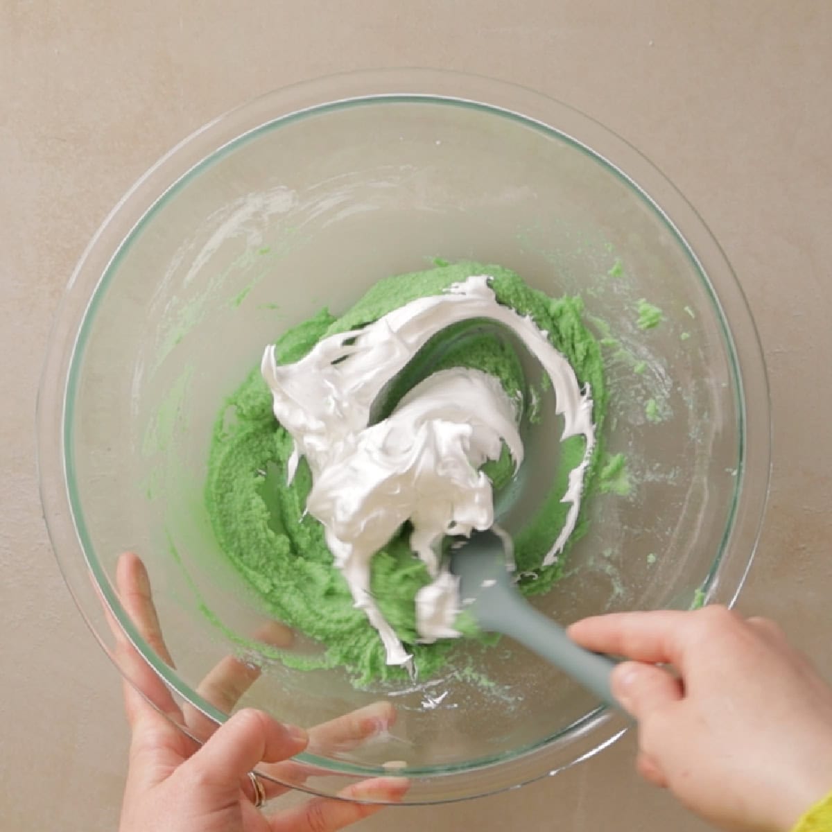 mixing the macaron batter.